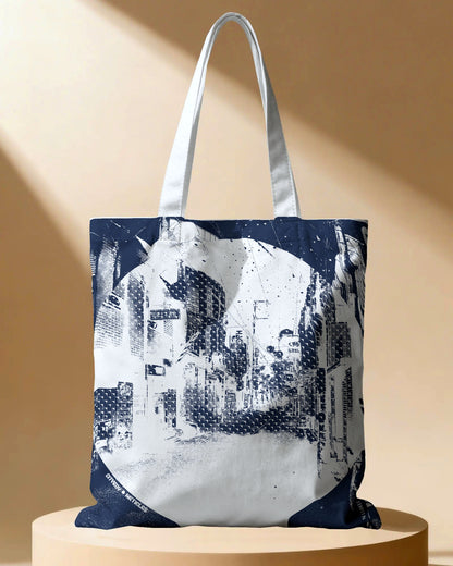 Tote bag with cityscape design on a beige background
