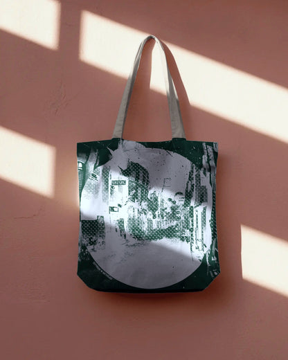 Tote bag with a cityscape design on a pink wall